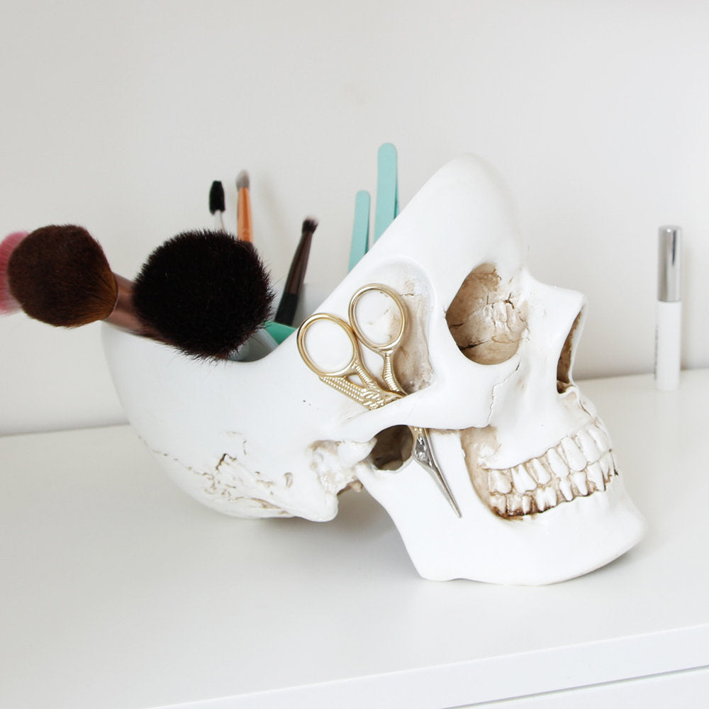 White Skull Tidy used to organise makeup brushes, scissors and beauty accessories