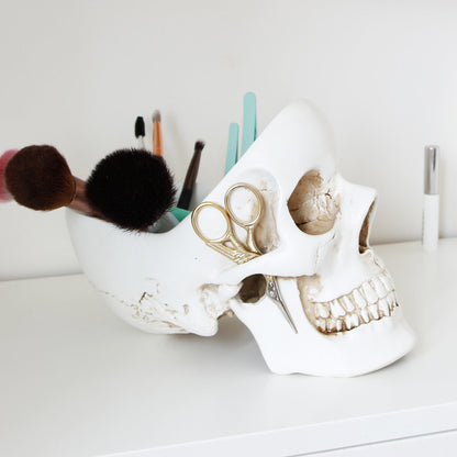 White Skull Tidy used to organise makeup brushes, scissors and beauty accessories